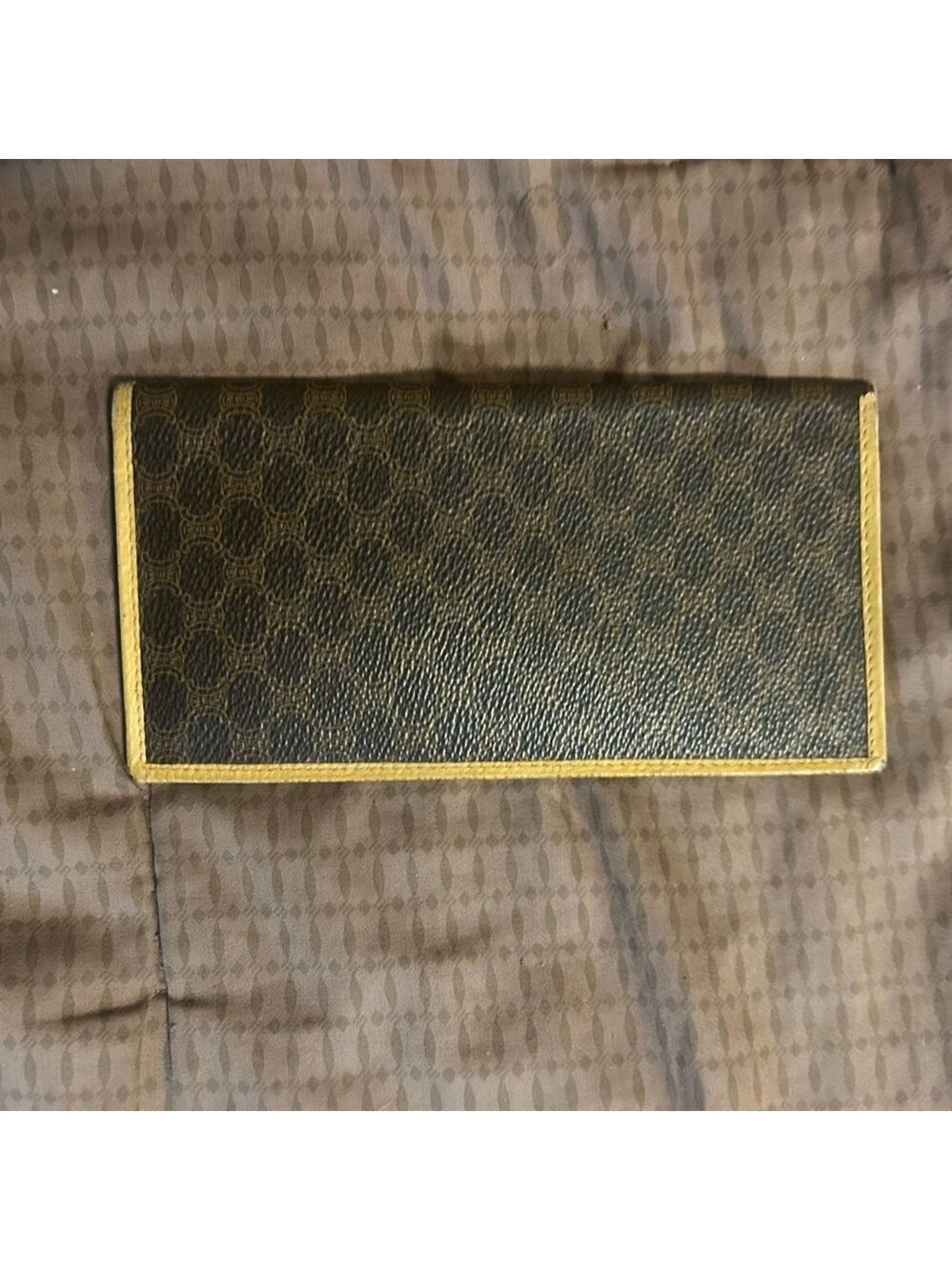 vintage Celine Macadam canvas long bifold wallet with leather trim.